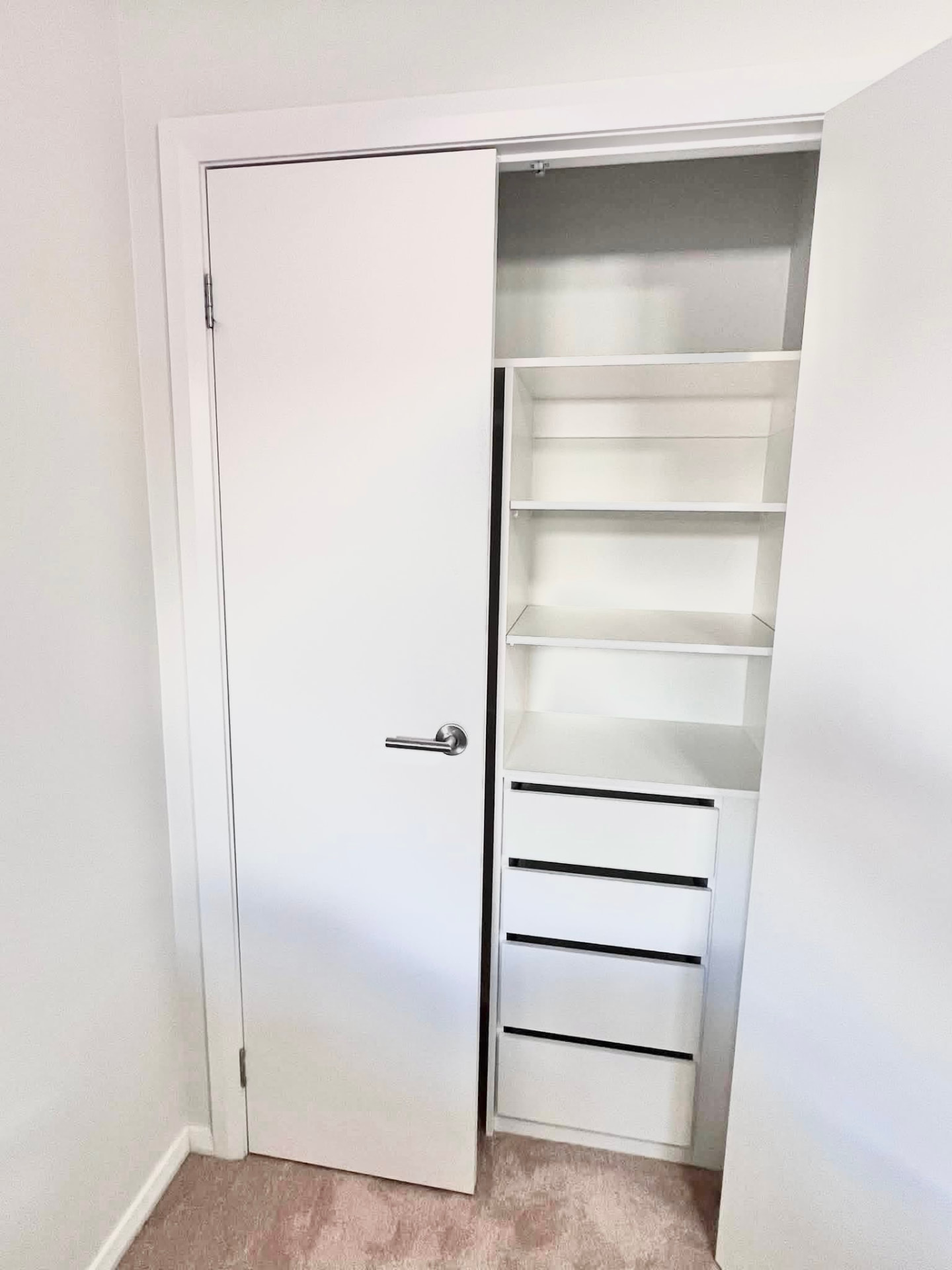 Custom wardrobe with adjustable shelving and soft-close drawers