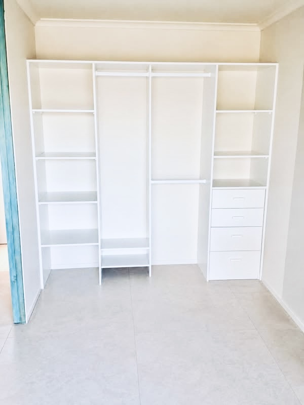 Built-in wardrobe fit-out with shelving, hanging space and drawers